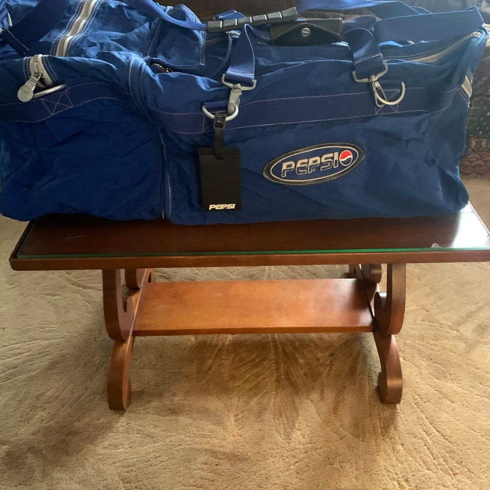 Large 3 bags in one Pepsi branded duffle.